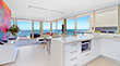 Looking from the kitchen through the lounge area of this Covcon renovation allows for spectacular ocean views